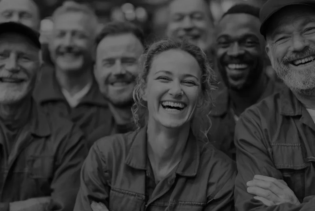 A smiling team of site workers in work jackets